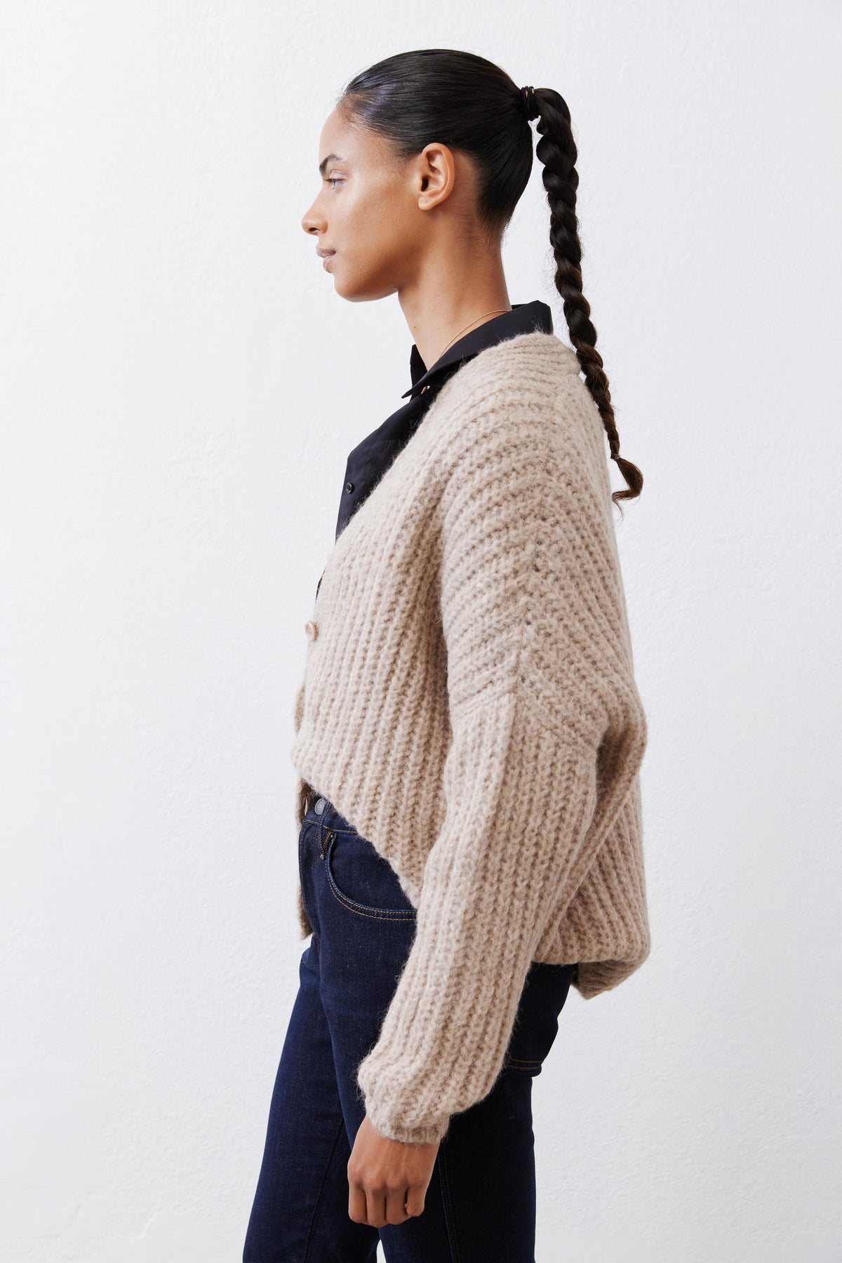 Oatmeal knit cardigan side view with button front and ribbed cuffs