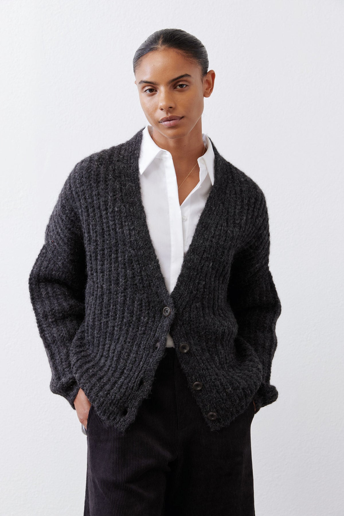 Heathered charcoal knit cardigan, deep V opening and button front