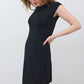 Black short-sleeve jersey dress, fitted silhouette, curved midi hem