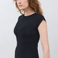 Black short-sleeve jersey dress, close-up of neckline and fitted bodice