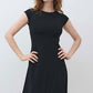 Black short-sleeve jersey dress, straight neckline, fitted waist, midi hem