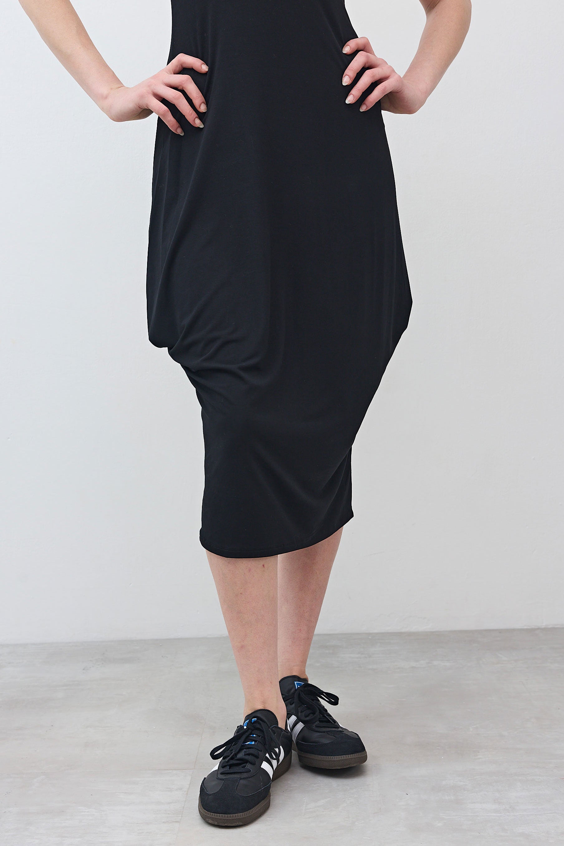 Black short-sleeve jersey dress, midi length, draped skirt detail at side