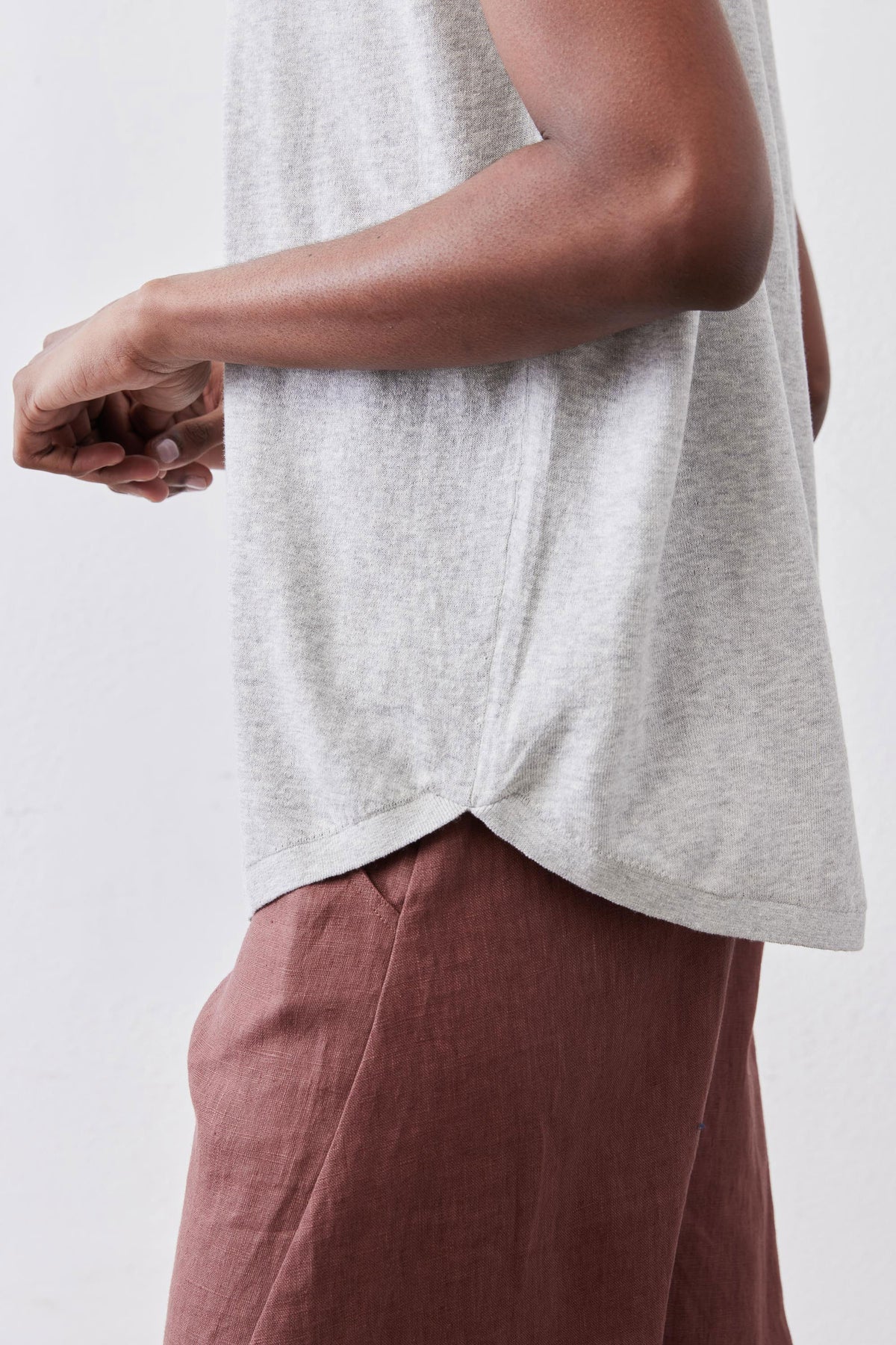 Light sweater top in heather light gray with side-slit hem and short sleeves