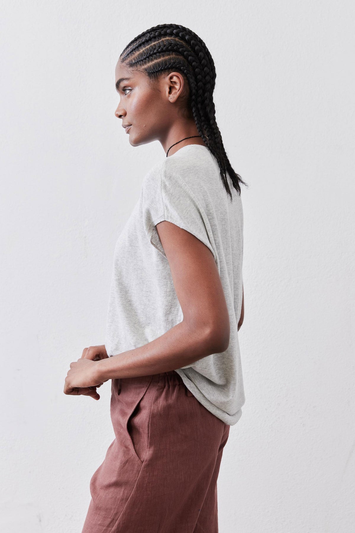 Light sweater top in heather light gray, side view with short sleeves