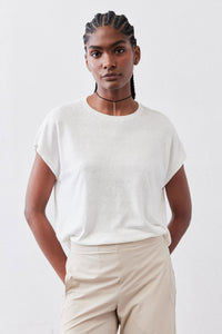 White light sweater top with short sleeves and crew neckline, draped relaxed fit