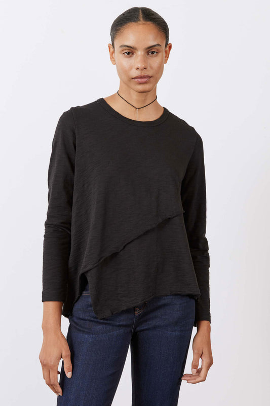 Black asymmetric long sleeve top with diagonal front panel and draped hem