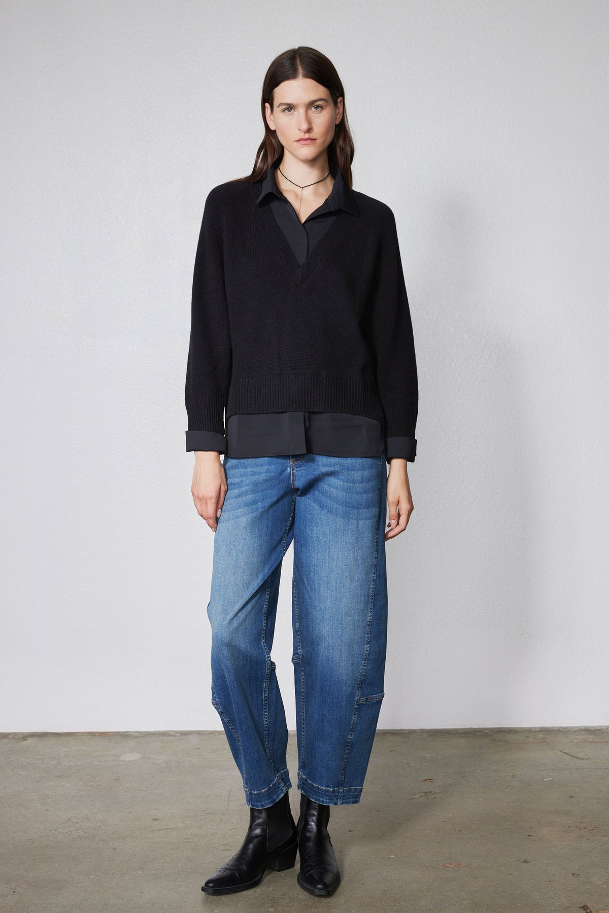 Black knit pullover sweater shirt with collared V-neck and button placket