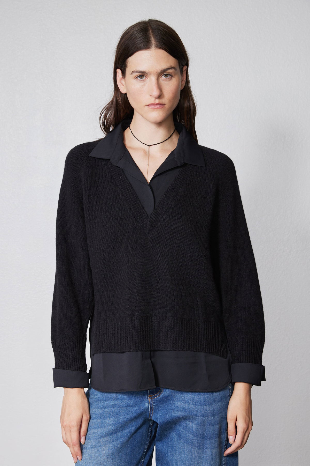 Black knit pullover sweater shirt with collared neckline and long cuffs