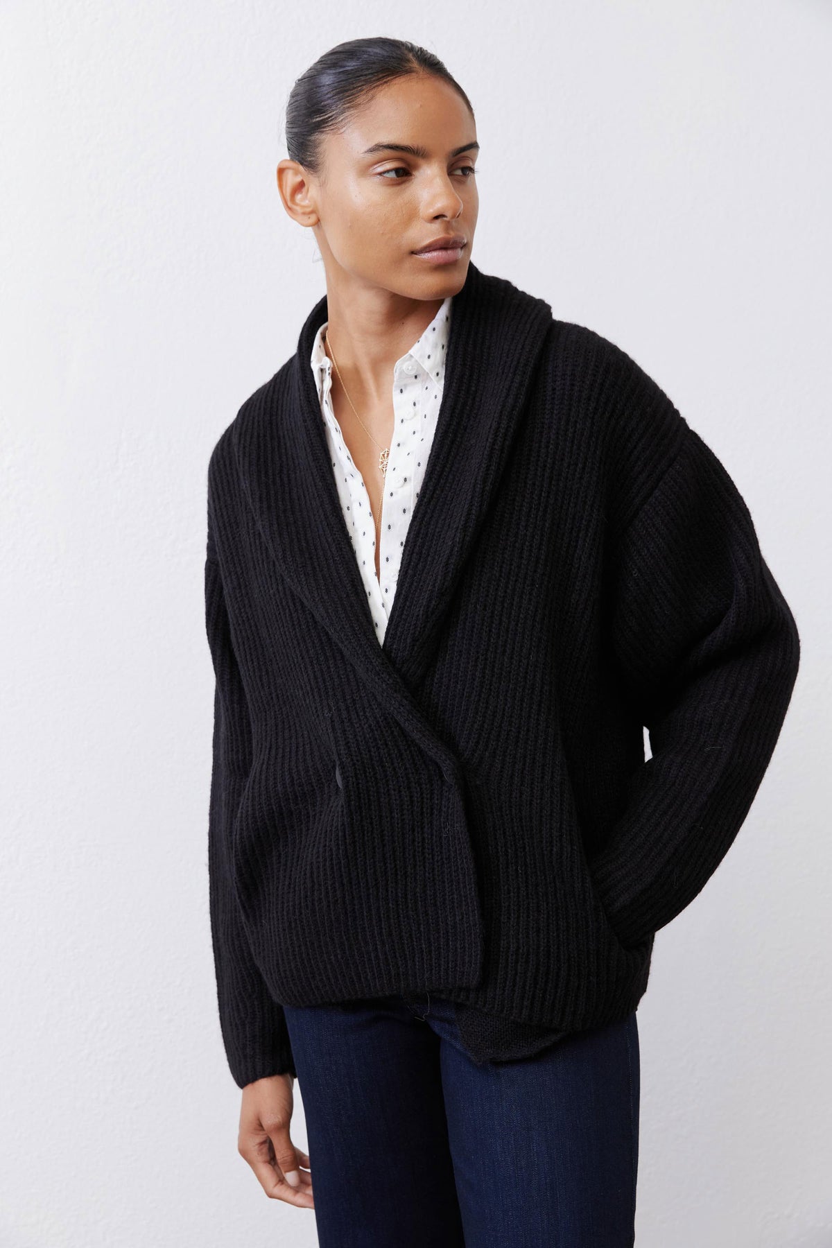 Black rib-knit shawl cardigan with button placket and long sleeves