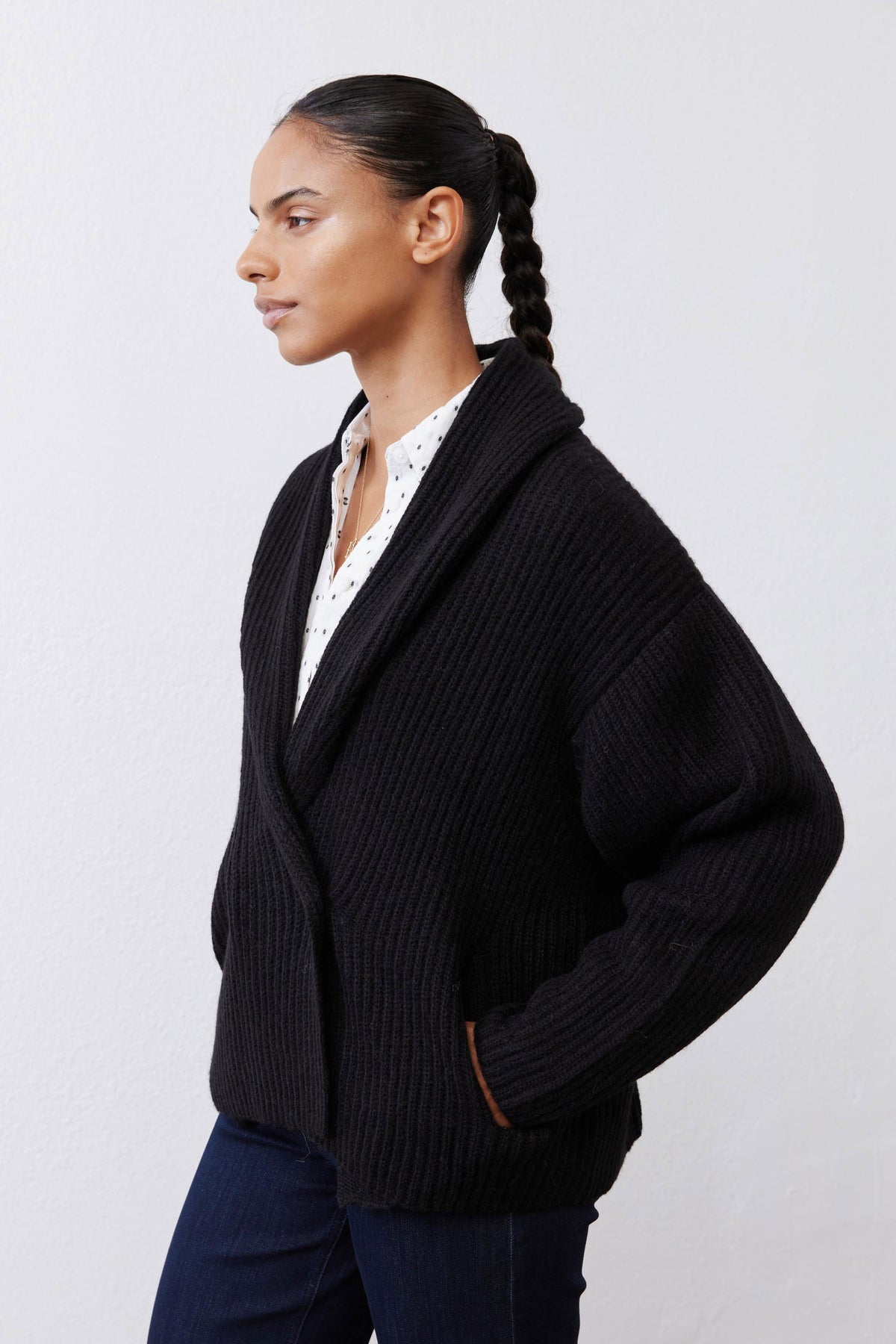 Black rib-knit shawl collar cardigan with button front and long sleeves