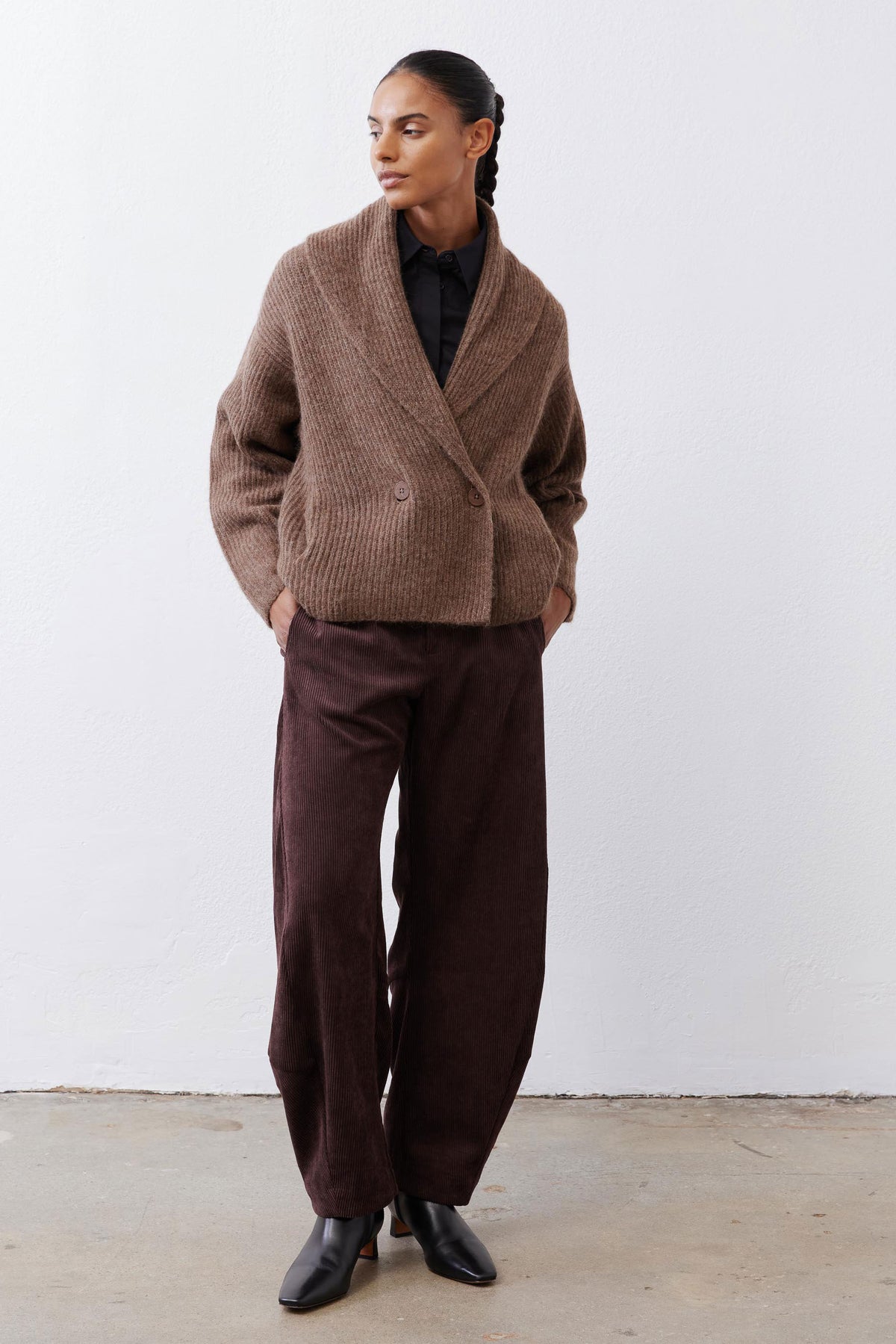 Oatmeal knit shawl-collar cardigan with button front and long sleeves