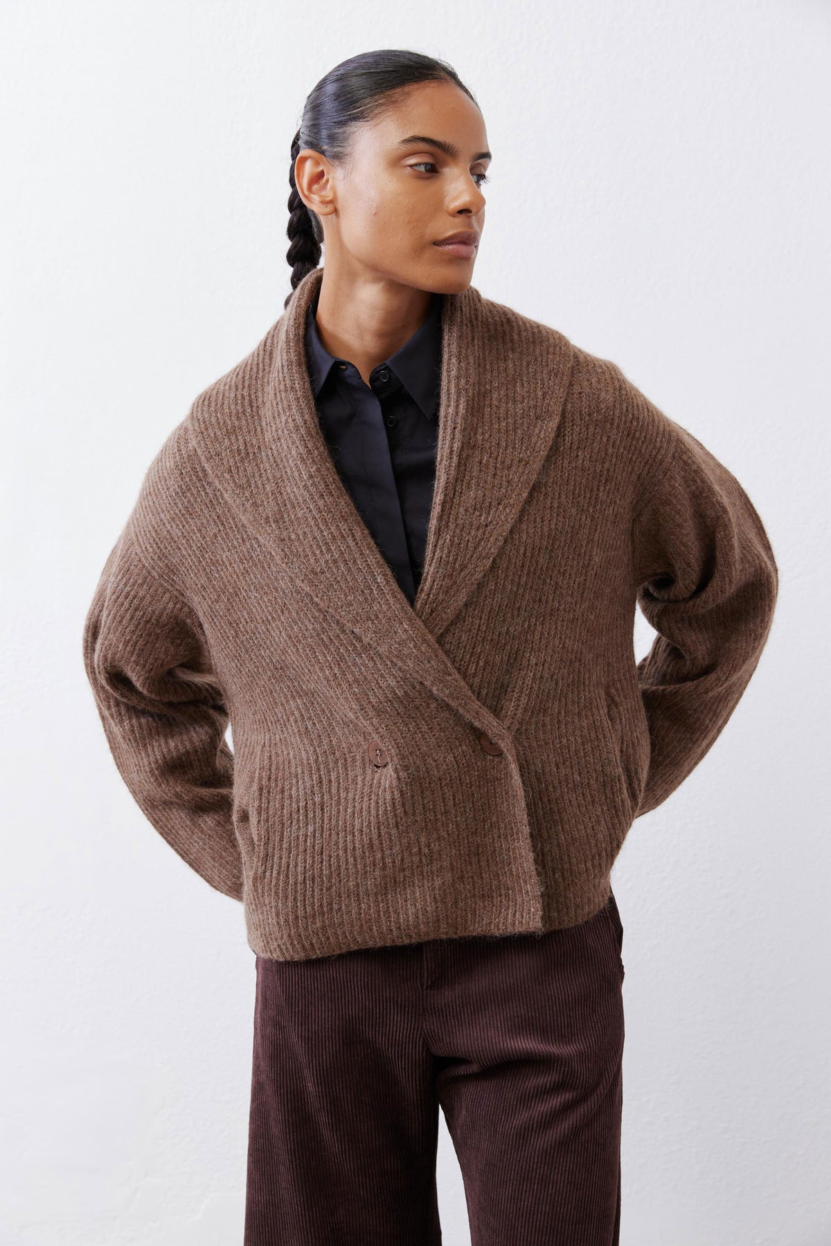 Oatmeal shawl-collar cardigan, long sleeves, button front detail at the chest