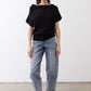 Black short-sleeve sweater with relaxed fit and draped neckline