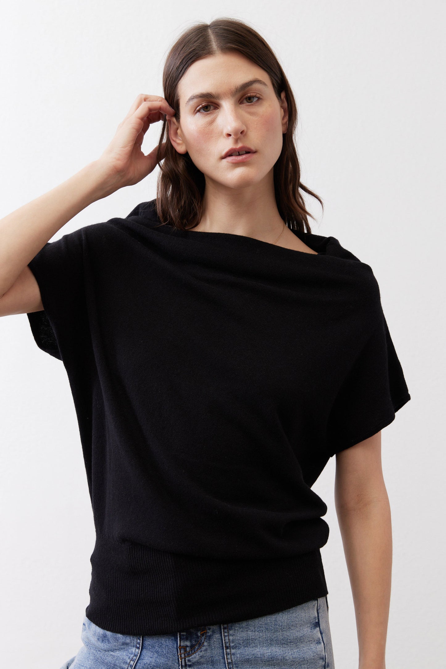 Black short-sleeve sweater with loose cowl drape at neckline