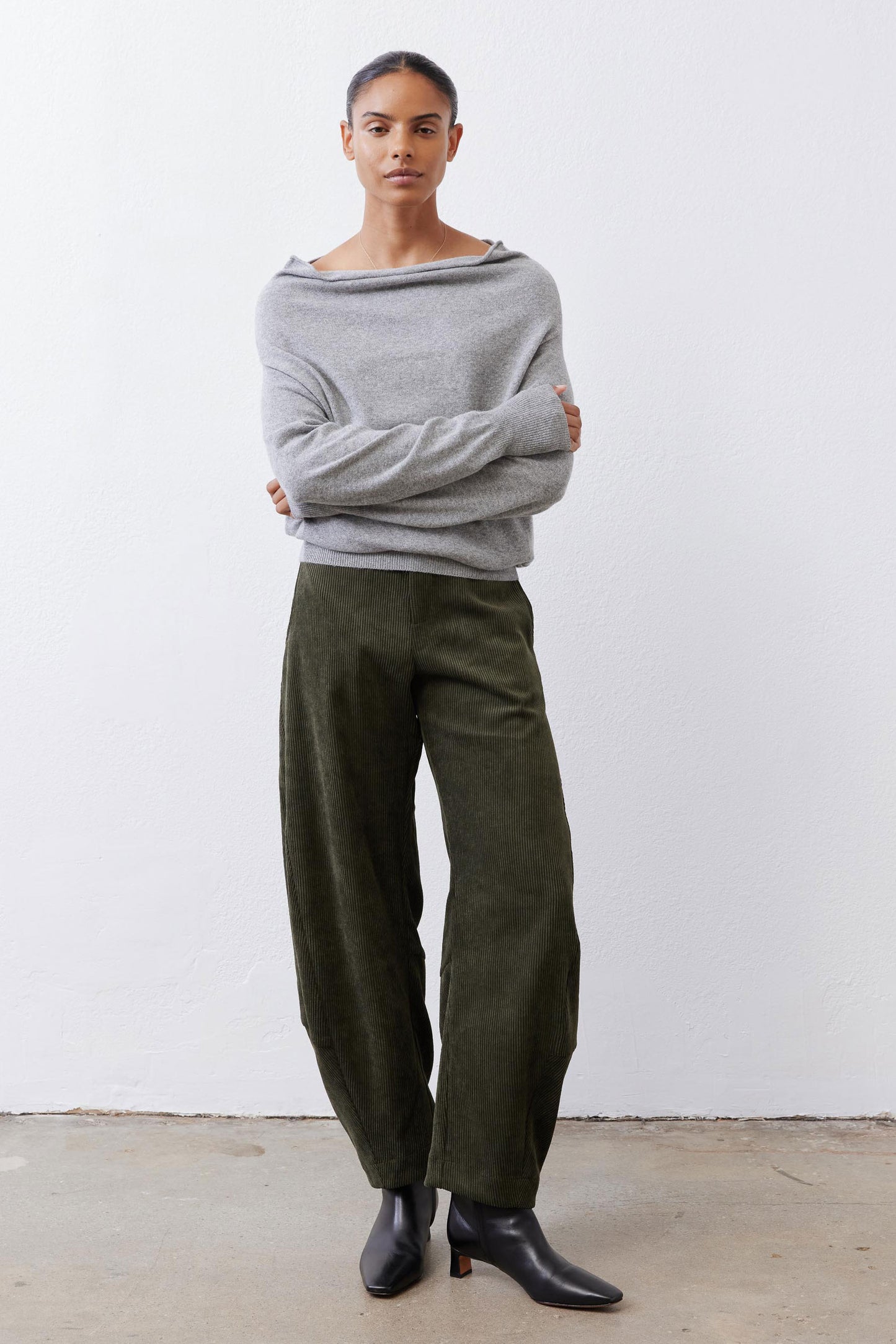 Silver heather knit crewneck sweater with long sleeves, relaxed drape fit.