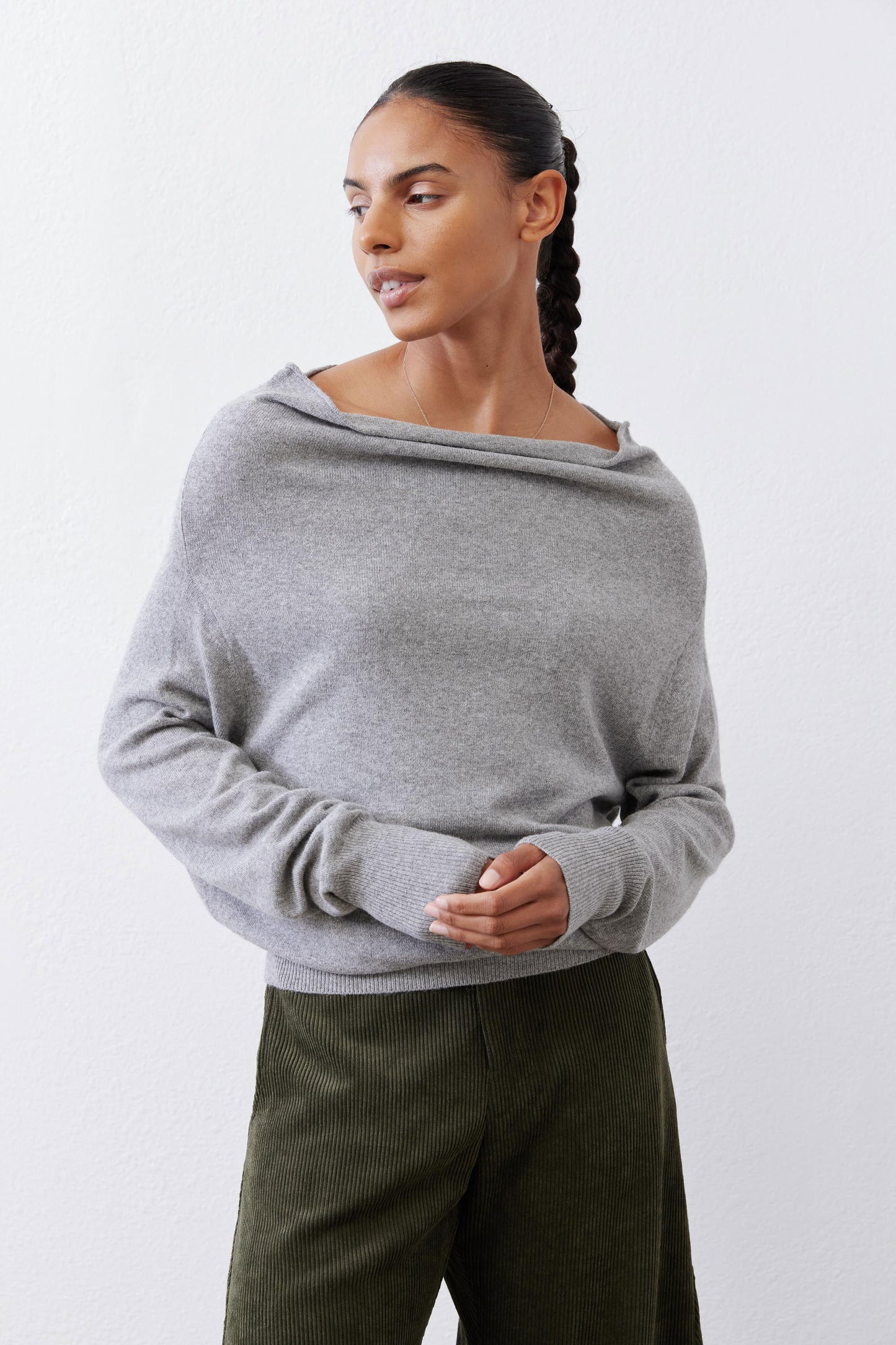 Silver heather knit crewneck sweater with long sleeves, soft drape neckline.