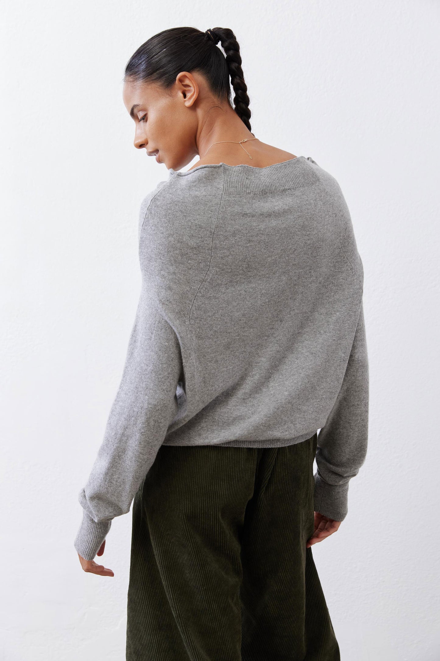 Silver heather knit crewneck sweater, long sleeves, back view showing yoke.