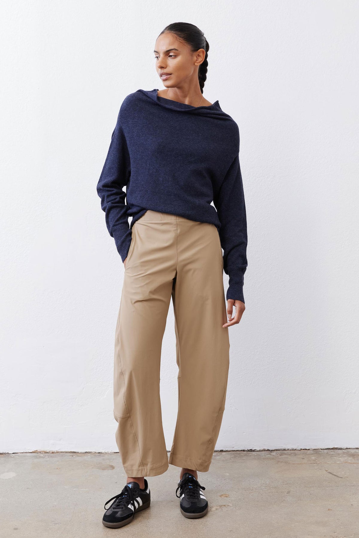 Navy cowl-neck knit sweater with long sleeves and relaxed fit