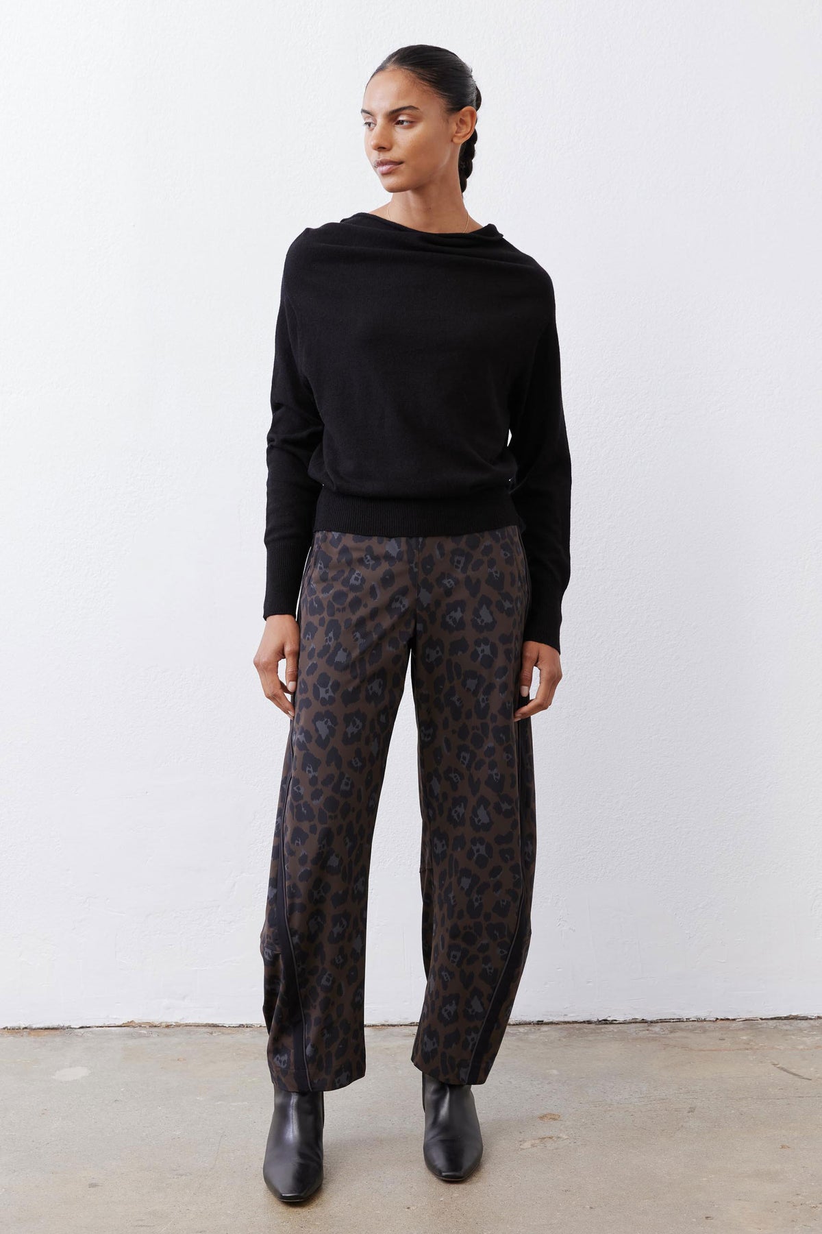Black cowl-neck pullover sweater with long sleeves and ribbed cuffs