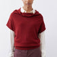 Dark cherry short-sleeve sweater with cowl neck; white long sleeves visible