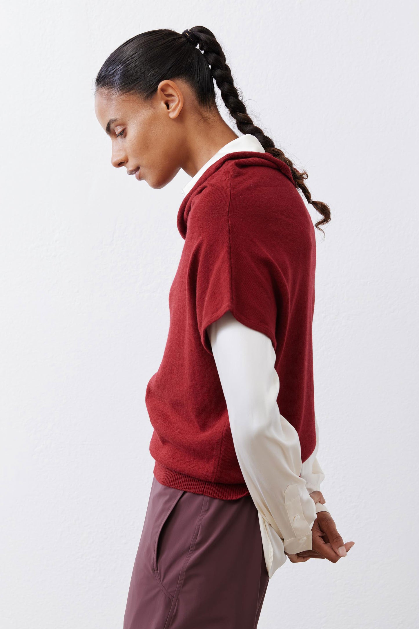 Dark cherry short-sleeve sweater in side profile with draped cowl neck