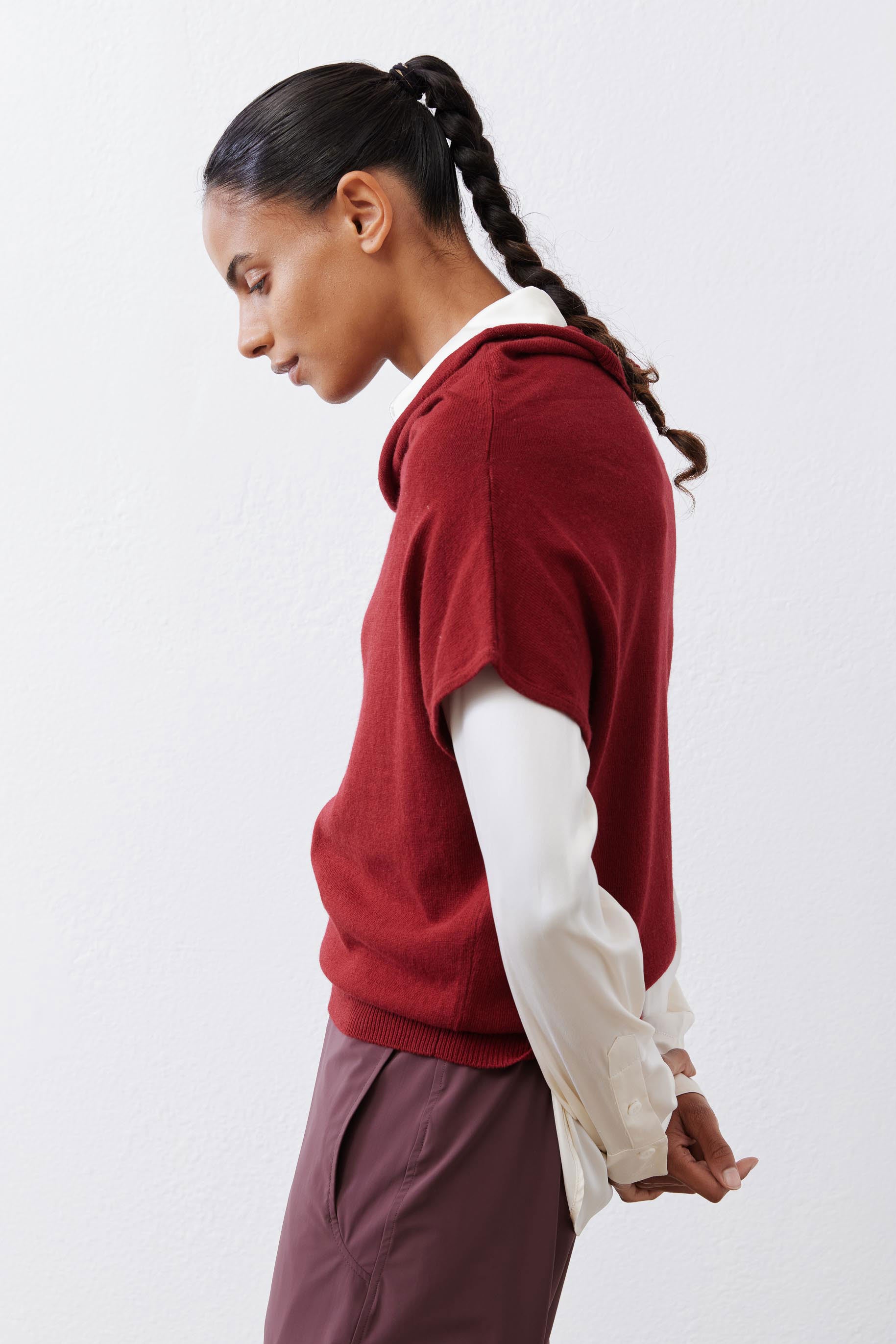 Dark cherry short-sleeve sweater in side profile with draped cowl neck