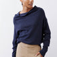 Navy cowl-neck sweater with long sleeves and soft knit texture