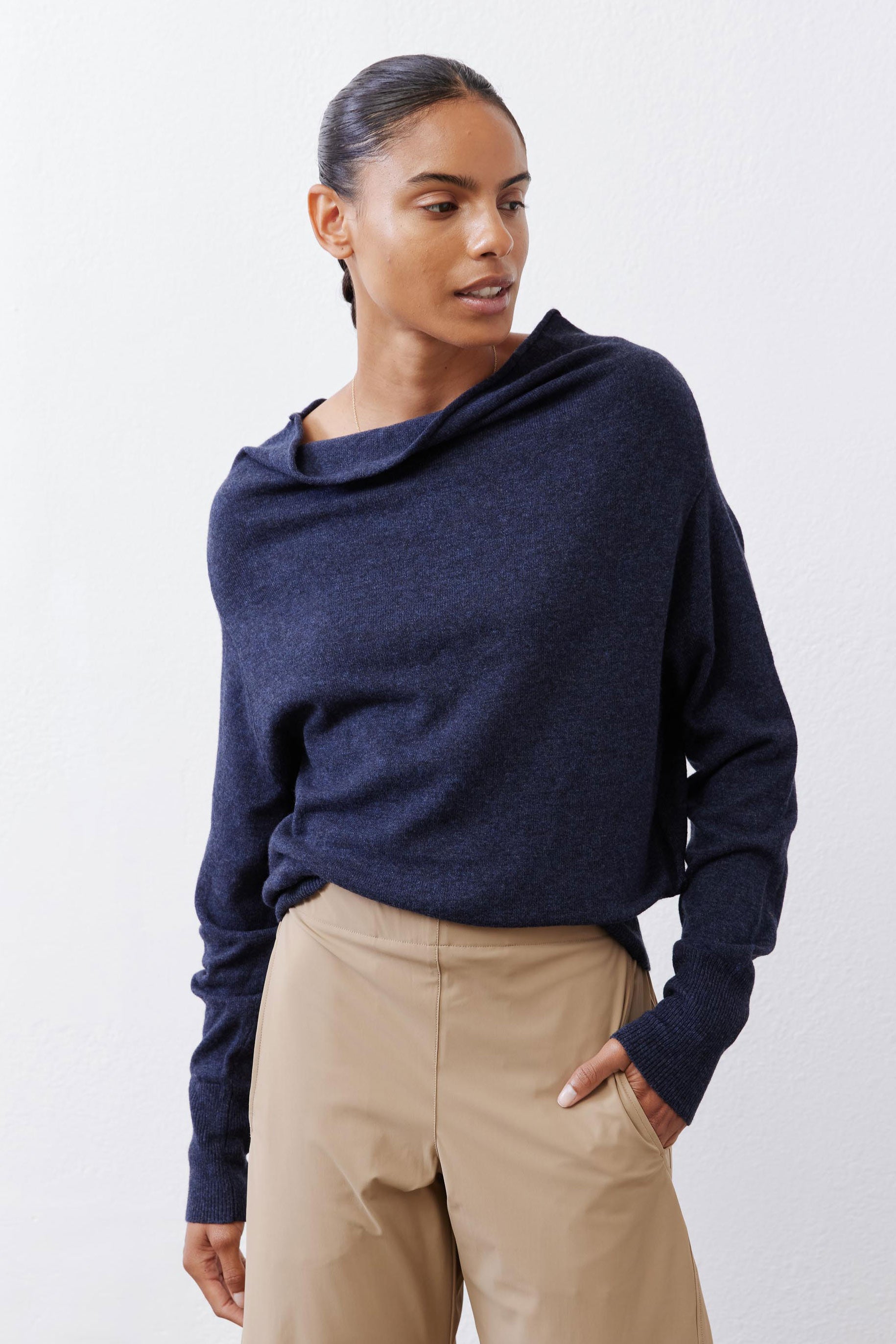 Navy cowl-neck sweater with long sleeves and soft knit texture