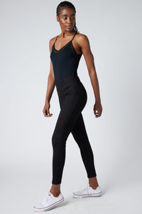 Black ankle-length smart leggings, close fitted silhouette with visible seam lines