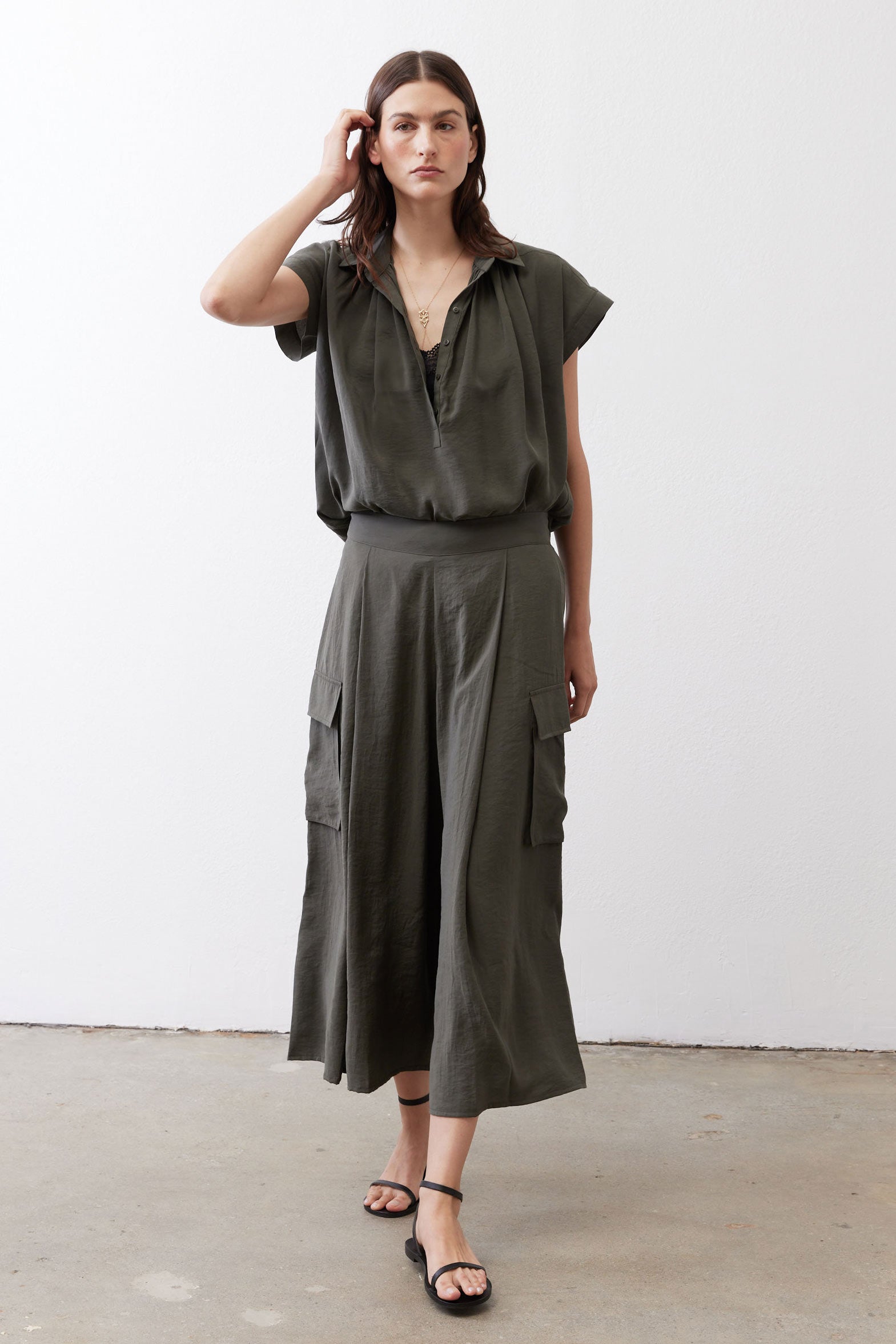 Oversized voile blouse in dark olive, short sleeves, V-neck button front, draped hem