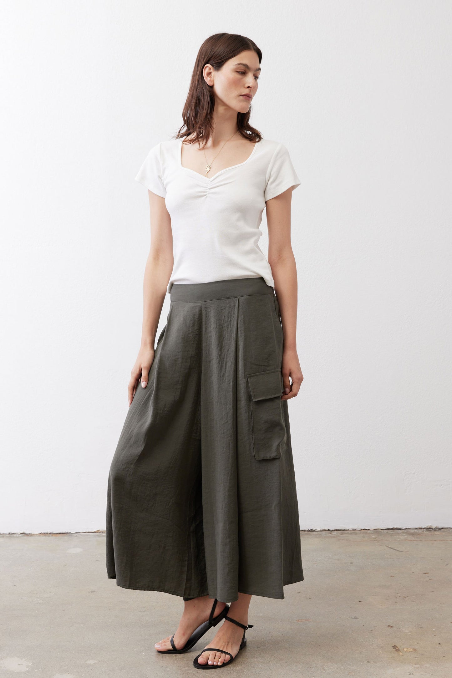 Olive cargo skirt pants with two cargo pockets and gathered elastic waistband