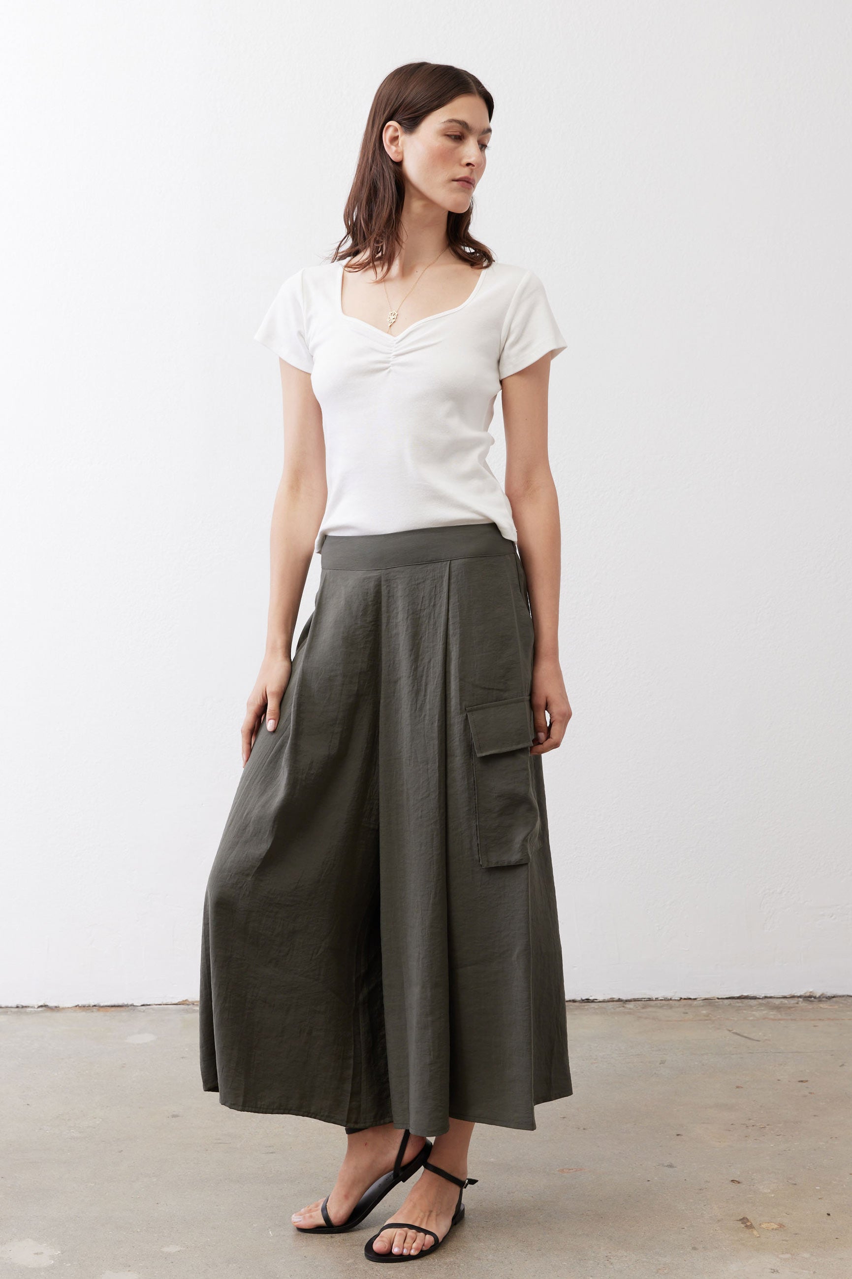 Olive cargo skirt pants with two cargo pockets and gathered elastic waistband