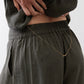 Olive cargo skirt pants with elastic waistband and front pocket detail