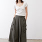 Olive cargo skirt pants with flap cargo pockets, elastic waist, and wide legs