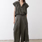Olive cargo skirt pants with flap cargo pockets and relaxed wide-leg fit