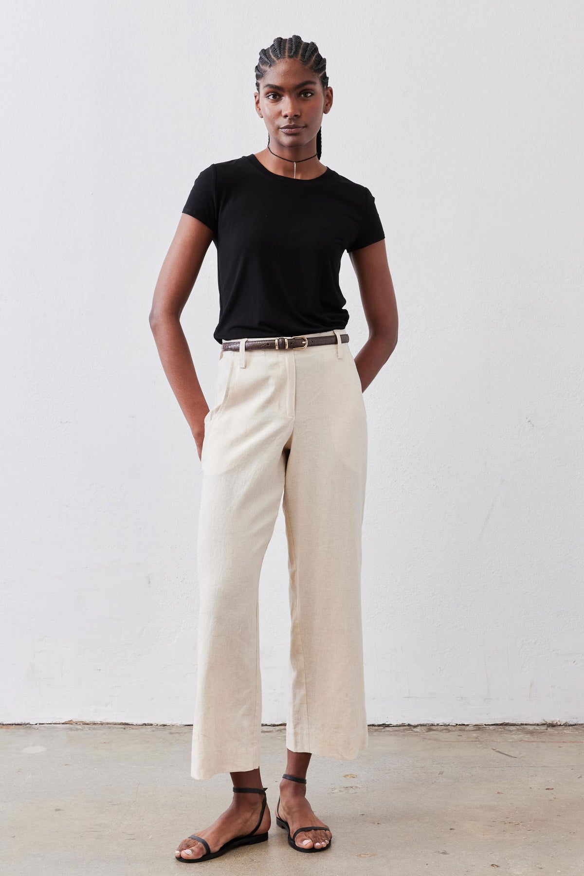 Oat linen A-line pants with a high belt loop waistband and wide leg openings.