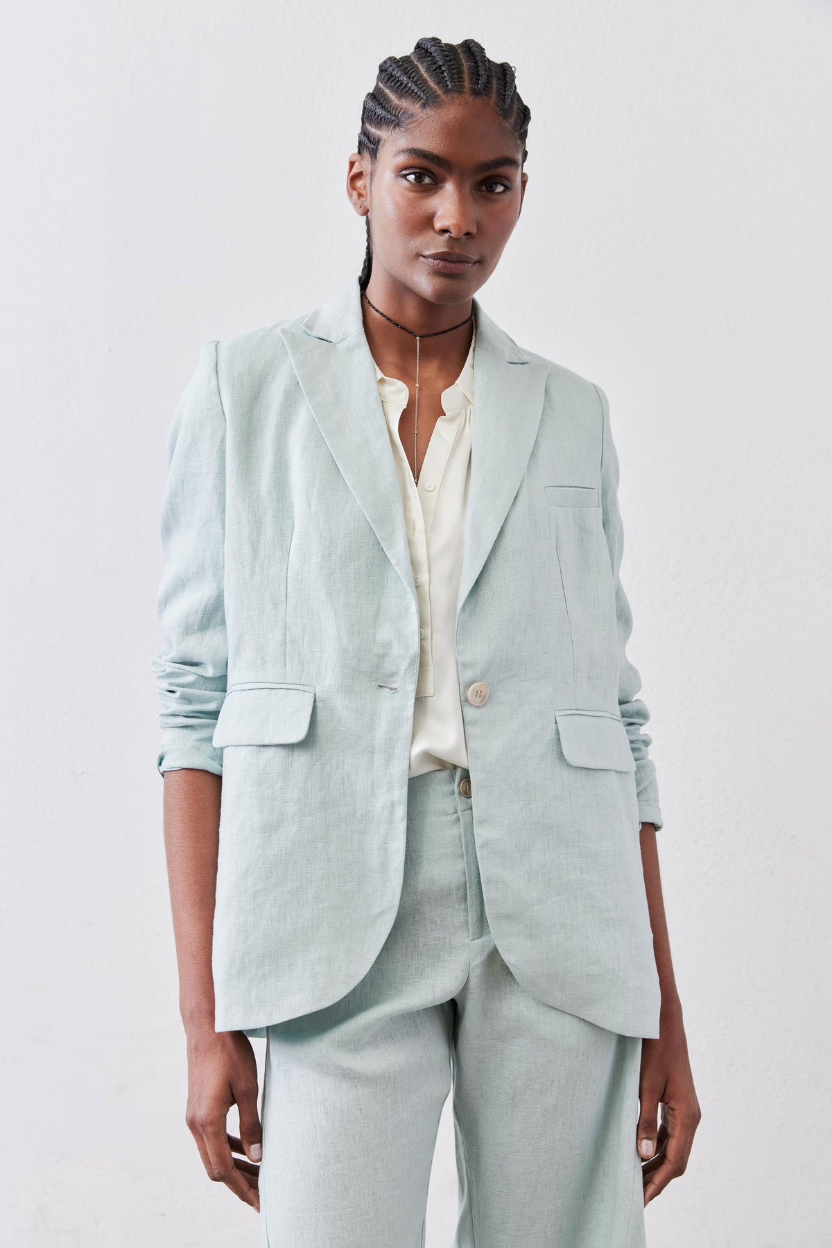 Mint linen blazer with notch lapels and flap pockets, single-button front, long sleeves