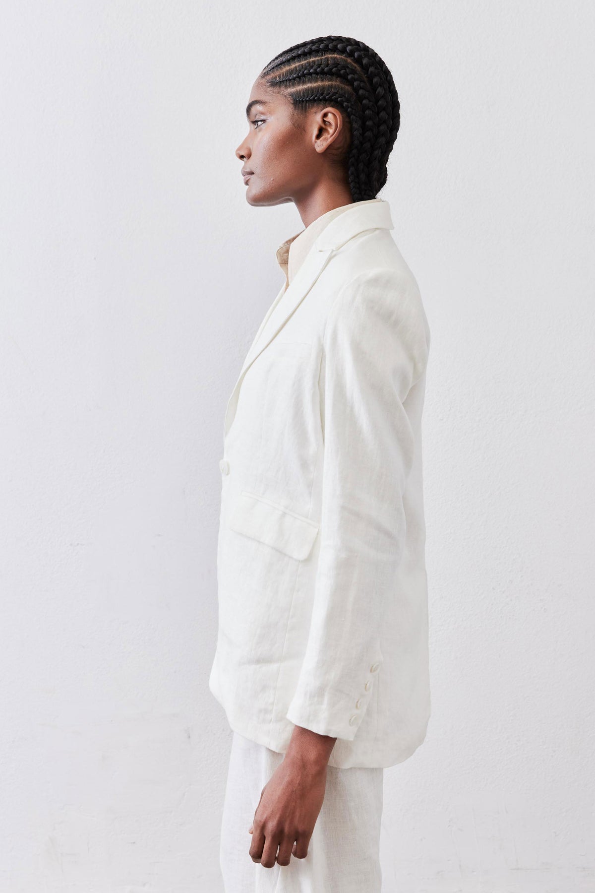 Vintage white linen blazer side profile, notch lapels and flap pocket detail