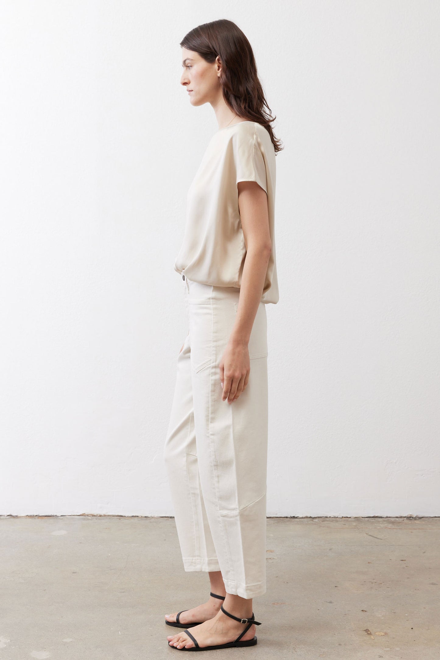Off-white silk blouse side view with short sleeves and relaxed drape