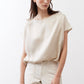 Off-white silk blouse with crew neck and short sleeves, draped loose fit