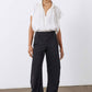 Black work pants with relaxed wide legs and elastic waistband, standing front view