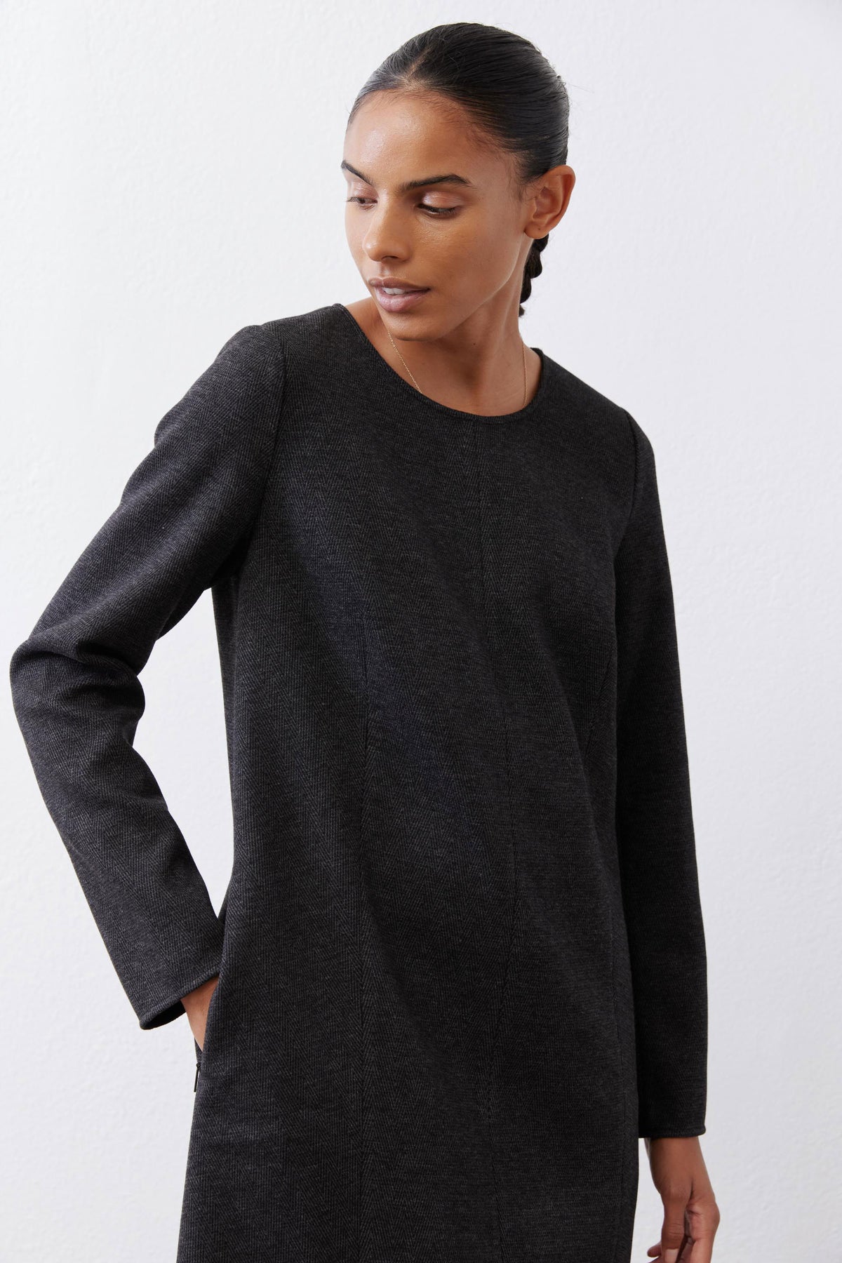 Charcoal herringbone long-sleeve ponte pocket dress close-up with relaxed crew neckline
