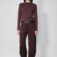 Brown long-sleeve mock-neck top with shoulder seam detailing and fitted silhouette