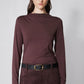 Brown long-sleeve mock-neck top with shoulder seam detailing and straight hem