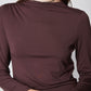 Brown mock-neck long-sleeve top with gathered shoulders and smooth fitted knit