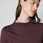 Brown mock-neck long-sleeve top with gathered shoulder line