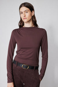 Brown long-sleeve mock-neck top with shoulder seam detailing and fitted front