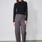 Black long-sleeve shoulder detail top with high neckline, front view