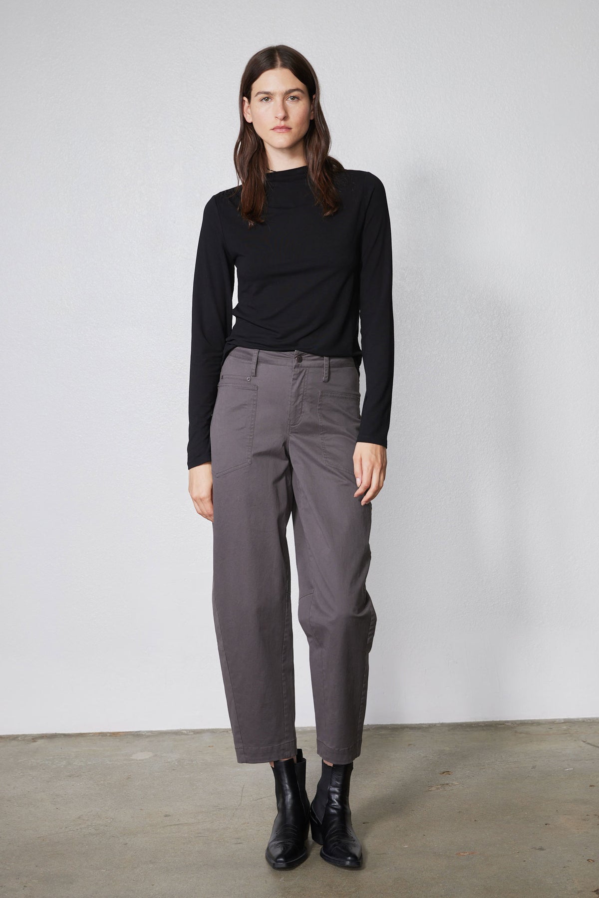 Black long-sleeve shoulder detail top with high neckline, front view