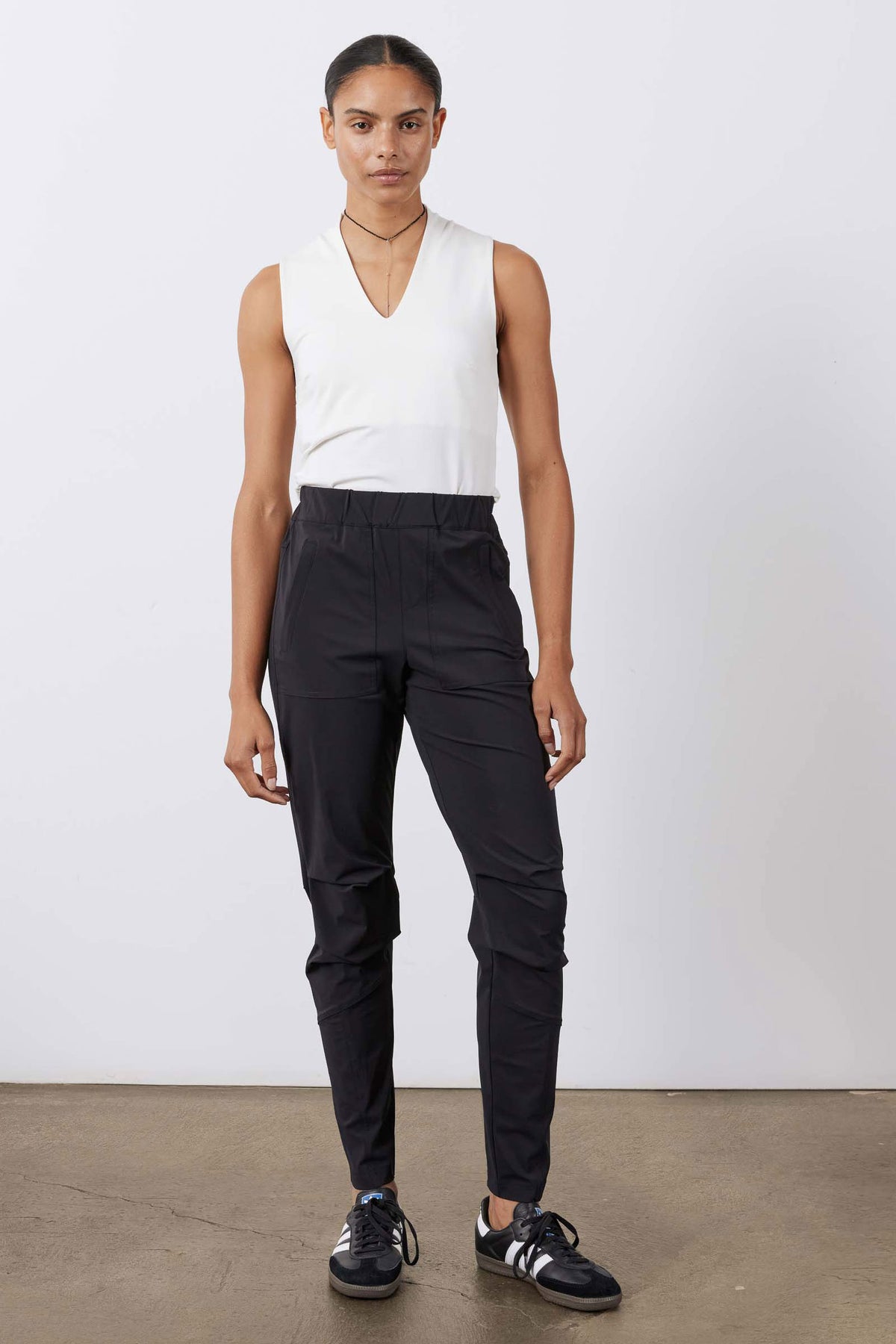 Black active jogger pants with elastic waistband and thigh flap pockets
